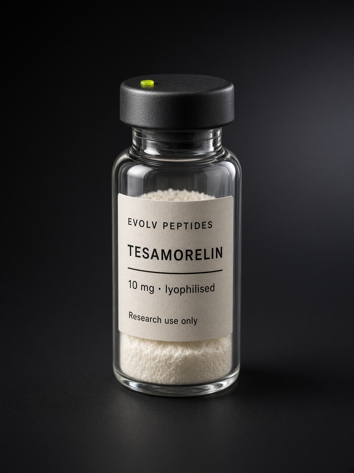 Sealed lyophilised research vial of EVOLV Tesamorelin 10 mg on a dark studio ground